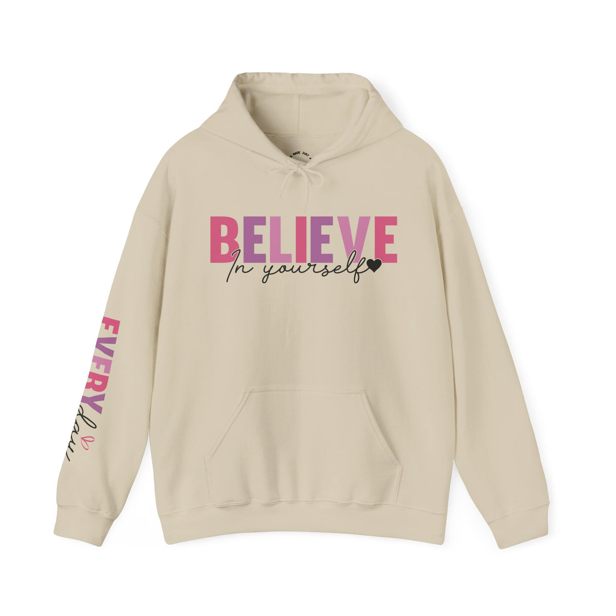 A beige pullover hoodie with a front graphic reading 'BELIEVE In yourself' in pink and black, plus matching pink text down one sleeve, shown on a plain white background.