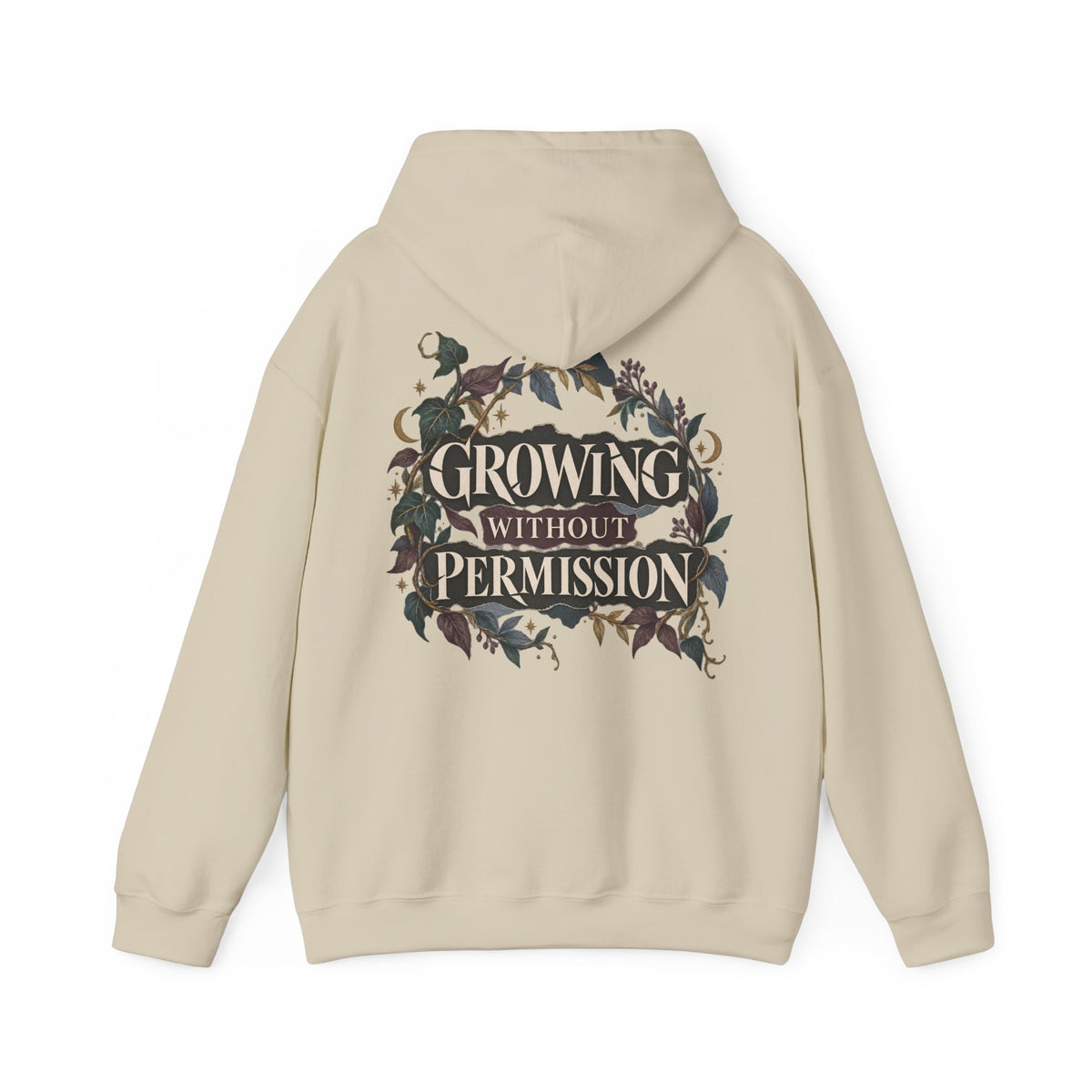 A beige pullover hoodie shown from the back, featuring a large graphic print with the text 'GROWING WITHOUT PERMISSION' in cream serif lettering, surrounded by a dark floral wreath design.