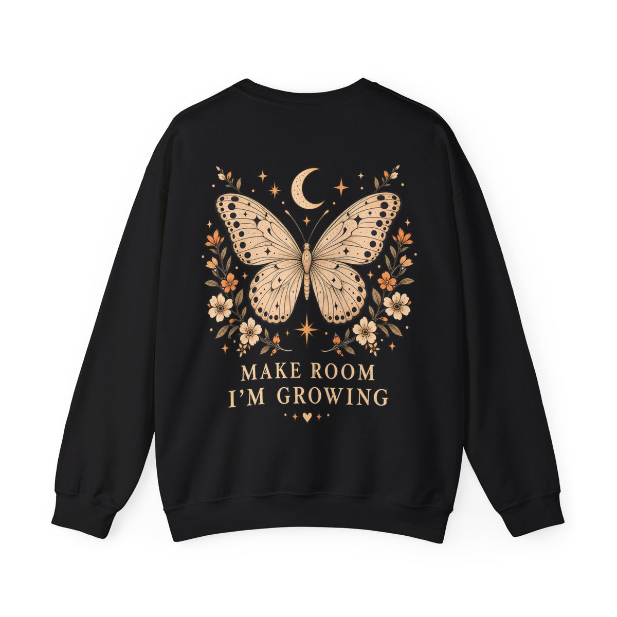 A black crewneck sweatshirt shown from the back, featuring a large graphic of a cream-colored butterfly surrounded by small flowers, stars, and a crescent moon, with the text 'MAKE ROOM I'M GROWING' printed below in a matching cream font.