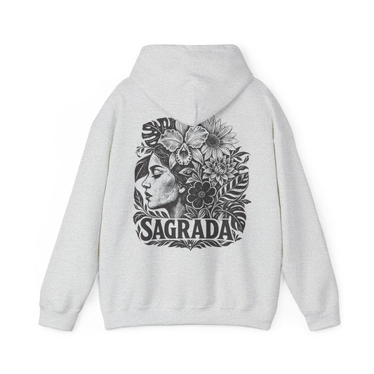 A light gray heather pullover hoodie shown from the back, featuring a large black graphic print of a woman's profile surrounded by flowers and the word 'SAGRADA'.