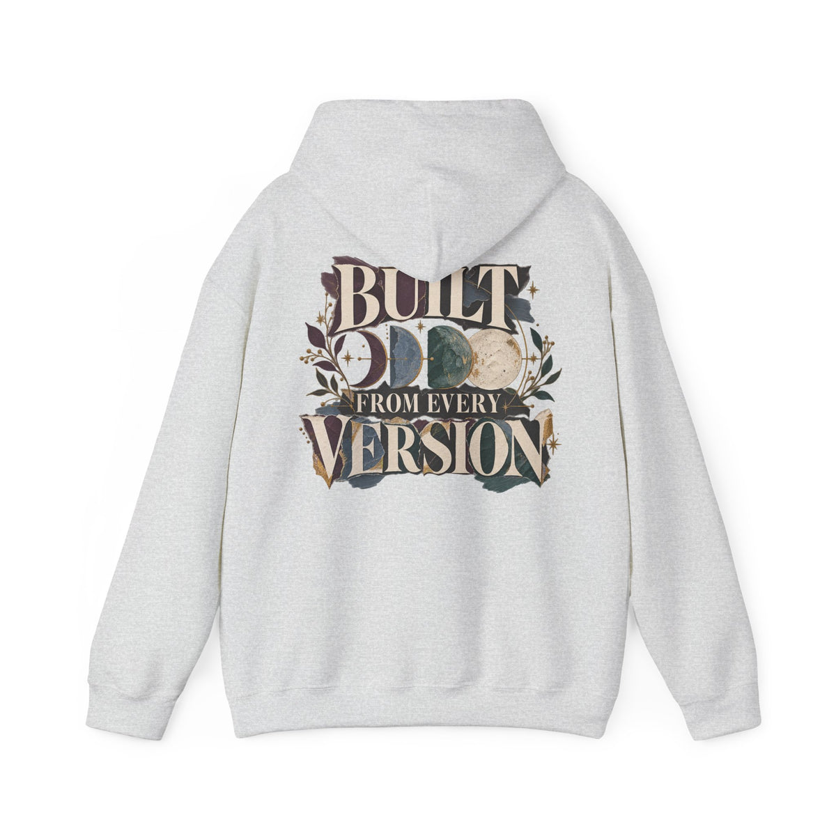 A light gray heather pullover hoodie shown from the back, featuring a large graphic print with the text 'BUILT FROM EVERY VERSION' and a circular moon phase design in earthy tones.