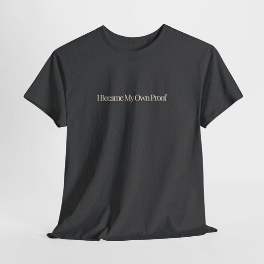 Dark Heather t-shirt with 'I became my own proof' in a cream serif text across mid-chest area.