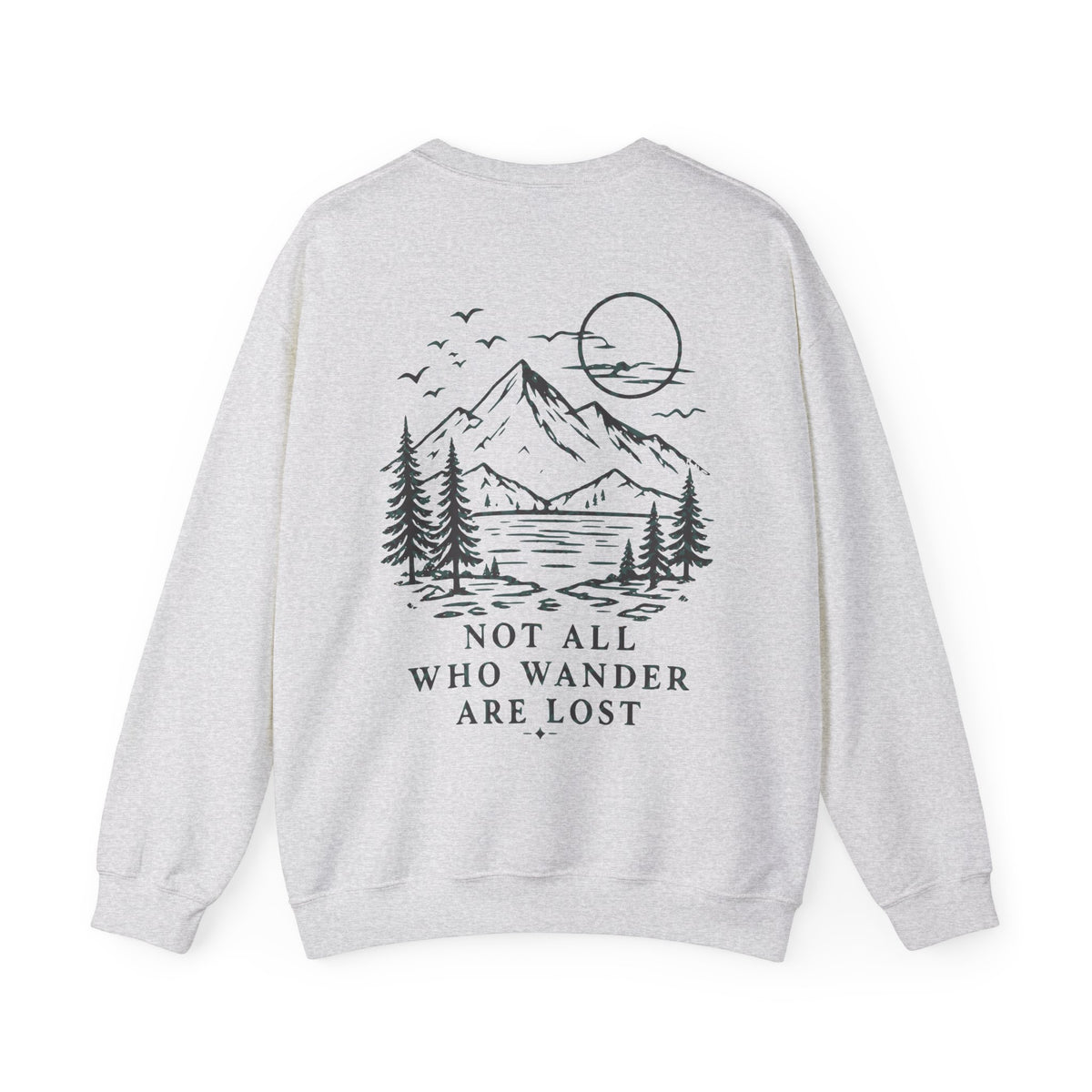 A light heather gray crewneck sweatshirt shown from the back, featuring a black line art graphic of a mountain, pine trees, and a full moon with the text 'NOT ALL WHO WANDER ARE LOST'.
