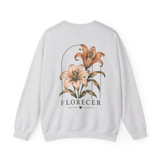 A light heather gray crewneck sweatshirt shown from the back, featuring a large graphic print of two lilies inside an arch with the word 'FLORECER' printed below.