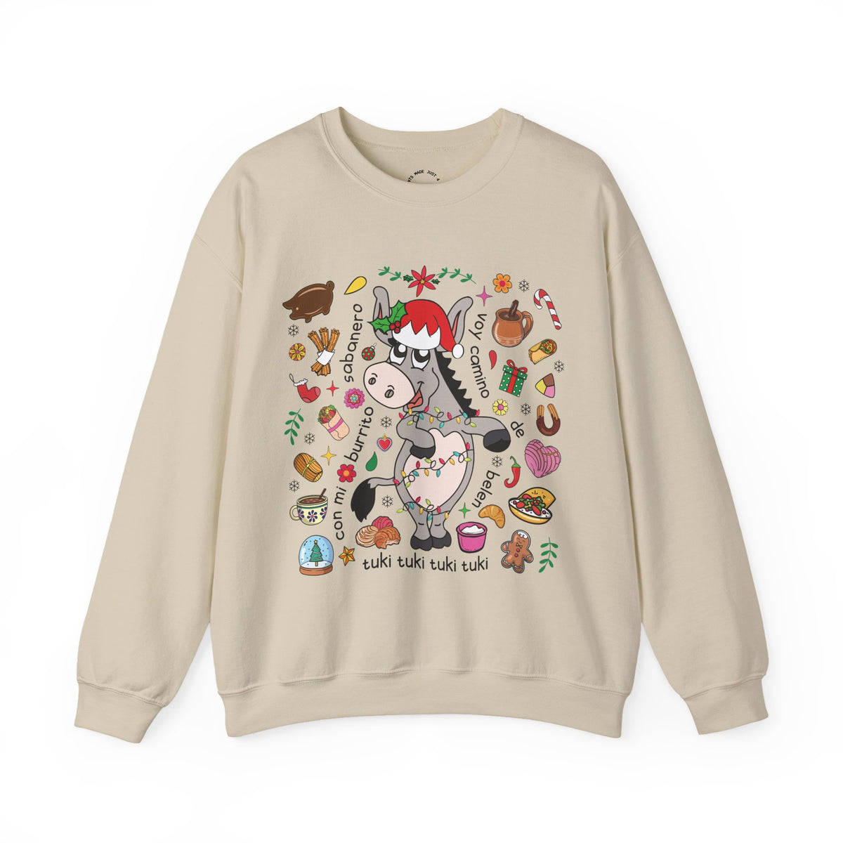 A beige crewneck sweatshirt featuring a colorful graphic of a cartoon donkey wearing a Santa hat, surrounded by festive Christmas illustrations and text, displayed on a clean white background.