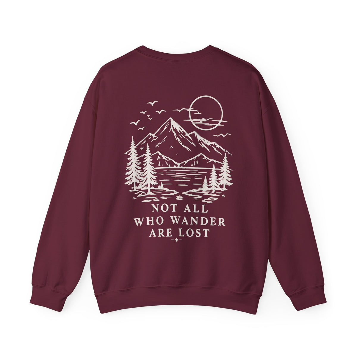 A maroon crewneck sweatshirt shown from the back, featuring a cream graphic print of a mountain, lake, pine trees, and a sun, with the text 'NOT ALL WHO WANDER ARE LOST' printed below.