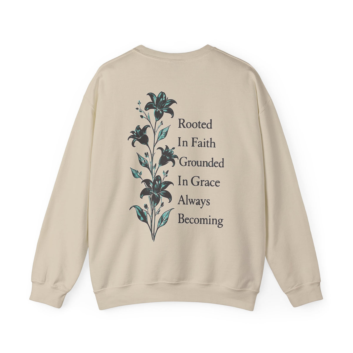 A beige crewneck sweatshirt shown from the back, featuring a vertical graphic of dark blue lilies next to the text 'Rooted In Faith Grounded In Grace Always Becoming' in dark gray.