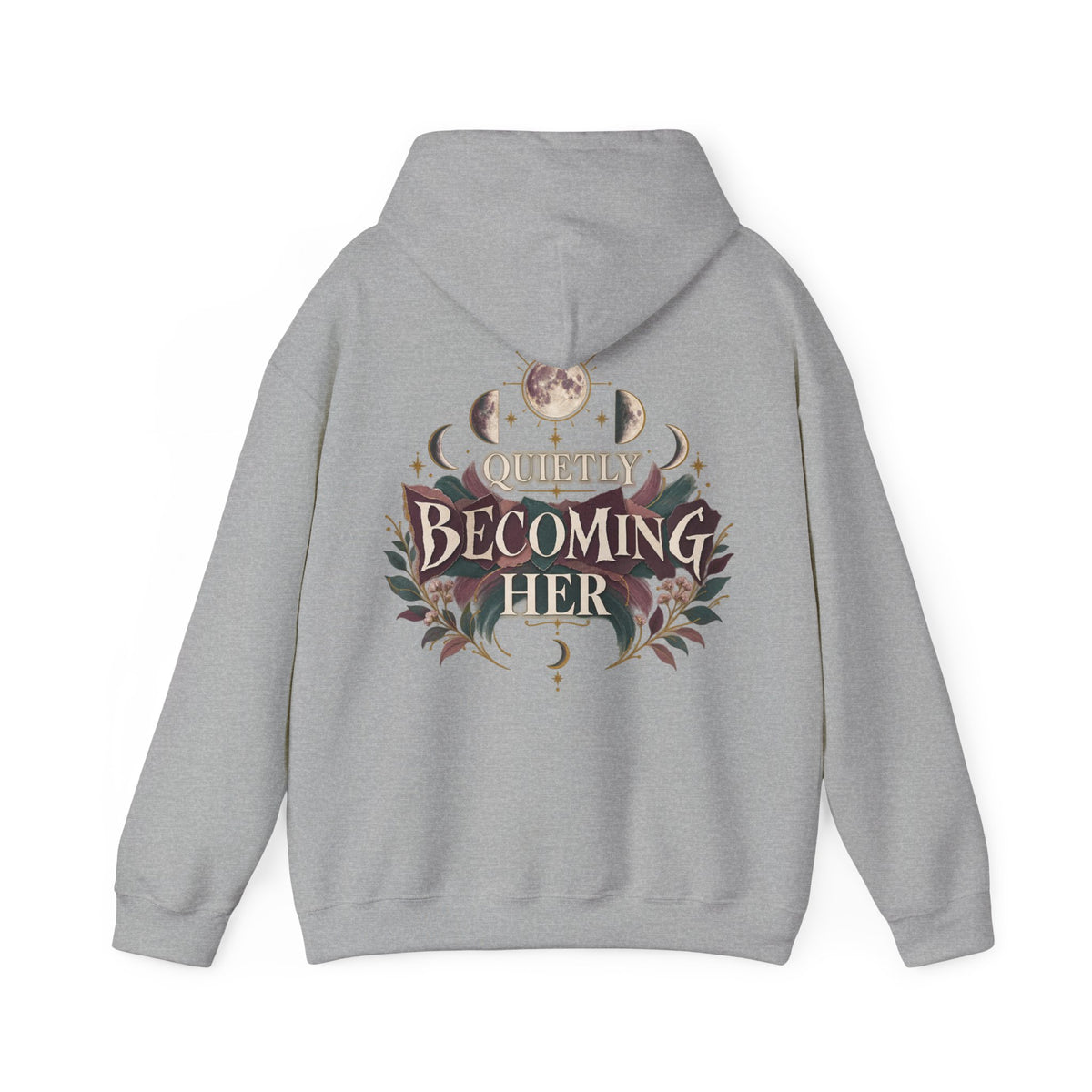 A light gray pullover hoodie shown from the back, featuring a large graphic print with the words 'Quietly Becoming Her' surrounded by decorative floral and celestial motifs in muted maroons, green, and gold tones.