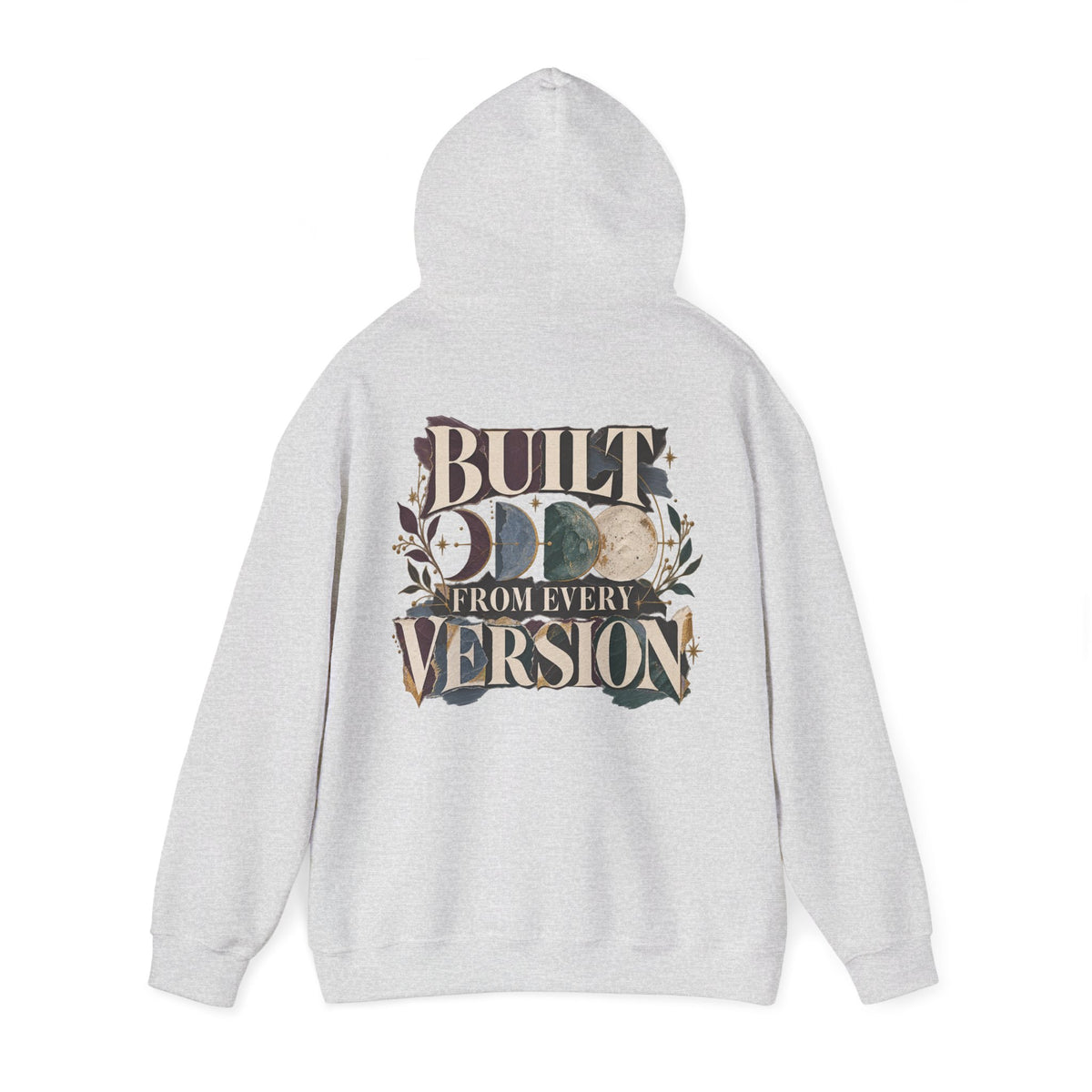 A light gray heather pullover hoodie shown from the back, featuring a large graphic print with the words 'BUILT FROM EVERY VERSION' and a moon phase design in muted earthy tones.