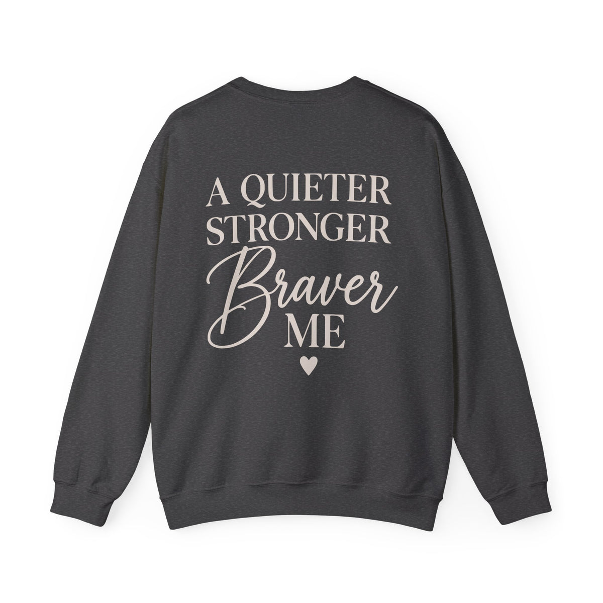 A dark charcoal gray crewneck sweatshirt shown from the back, featuring the text 'A QUIETER STRONGER Braver ME' in a light beige/cream font, with a small matching heart below.