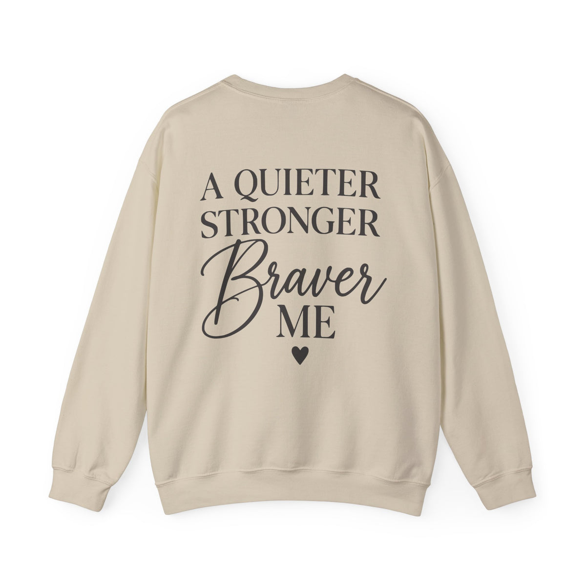 A beige crewneck sweatshirt shown from the back, featuring the text 'A QUIETER STRONGER Braver ME' in black lettering with a small heart below.