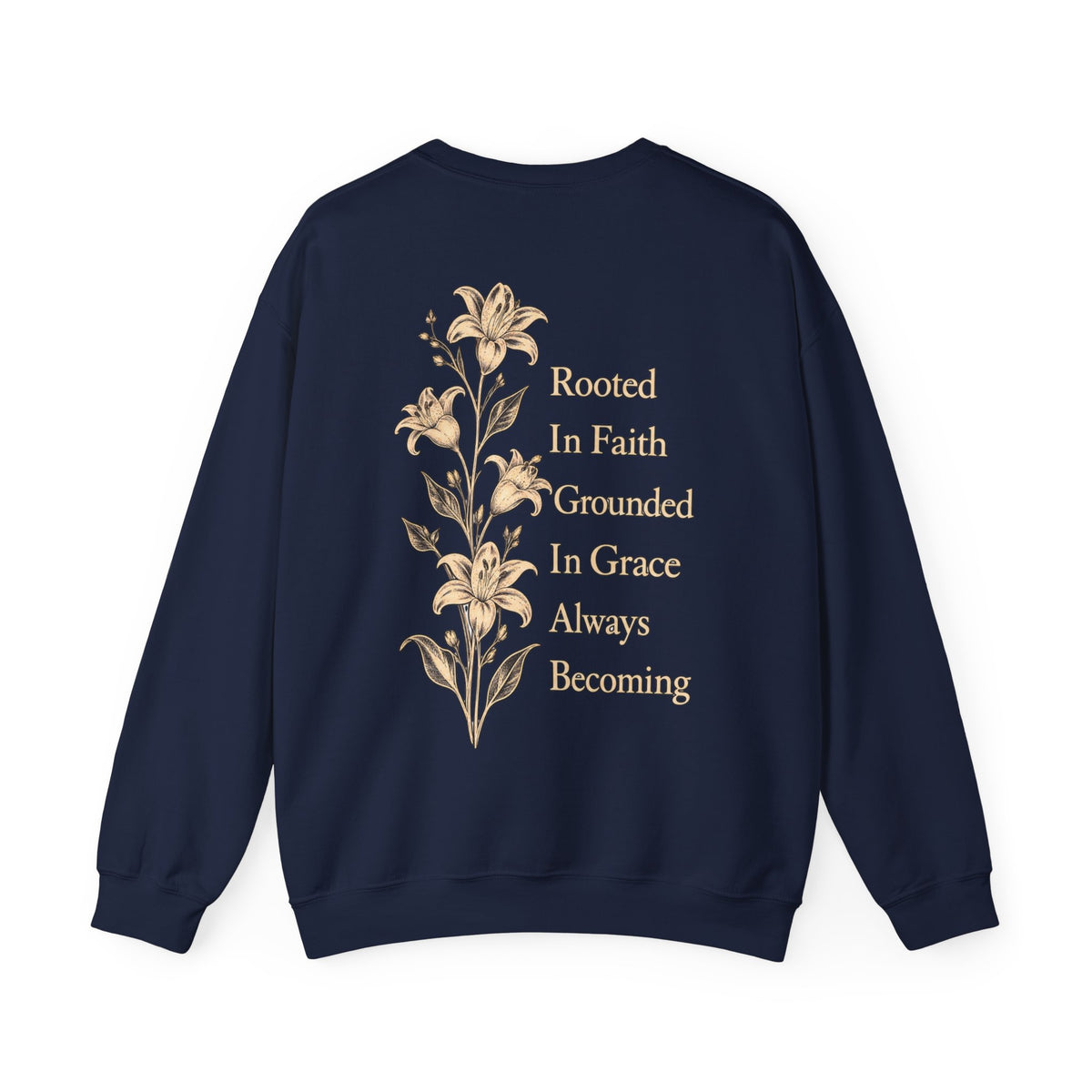 A navy blue crewneck sweatshirt shown from the back, featuring a vertical graphic of beige lilies and the text 'Rooted In Faith Grounded In Grace Always Becoming' in a matching beige serif font, set against a plain white background.
