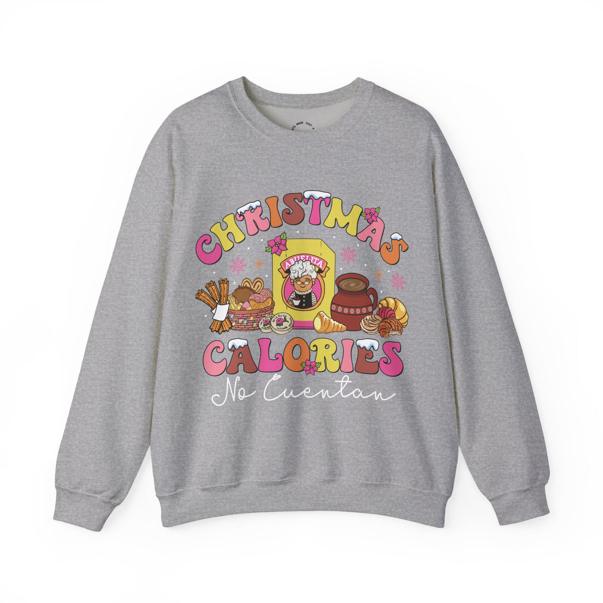 A heather gray crewneck sweatshirt featuring a colorful graphic print on the front with the text 'CHRISTMAS CALORIES No Cuentan' and cartoon illustrations of holiday treats and characters.